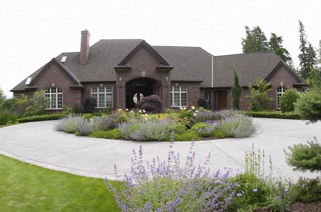 Brick custom home with a circular drive in Duvall Valley