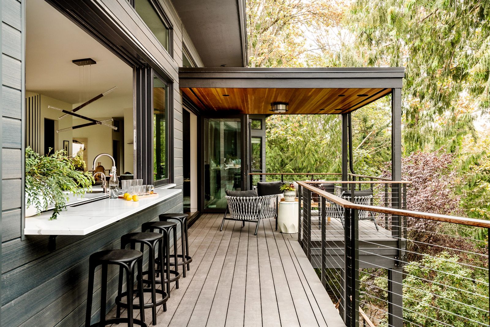 Covered deck with a counter running out from the kitchen, Mercer Island custom home