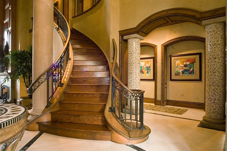 Curved wooden staircase in the Mercer Island waterfront custom home