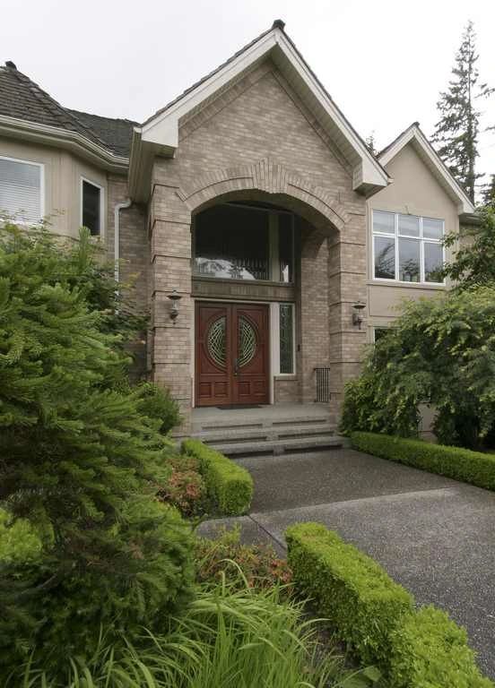 Arched stone entry of a Woodinville home originally built by Gregerson Custom Homes